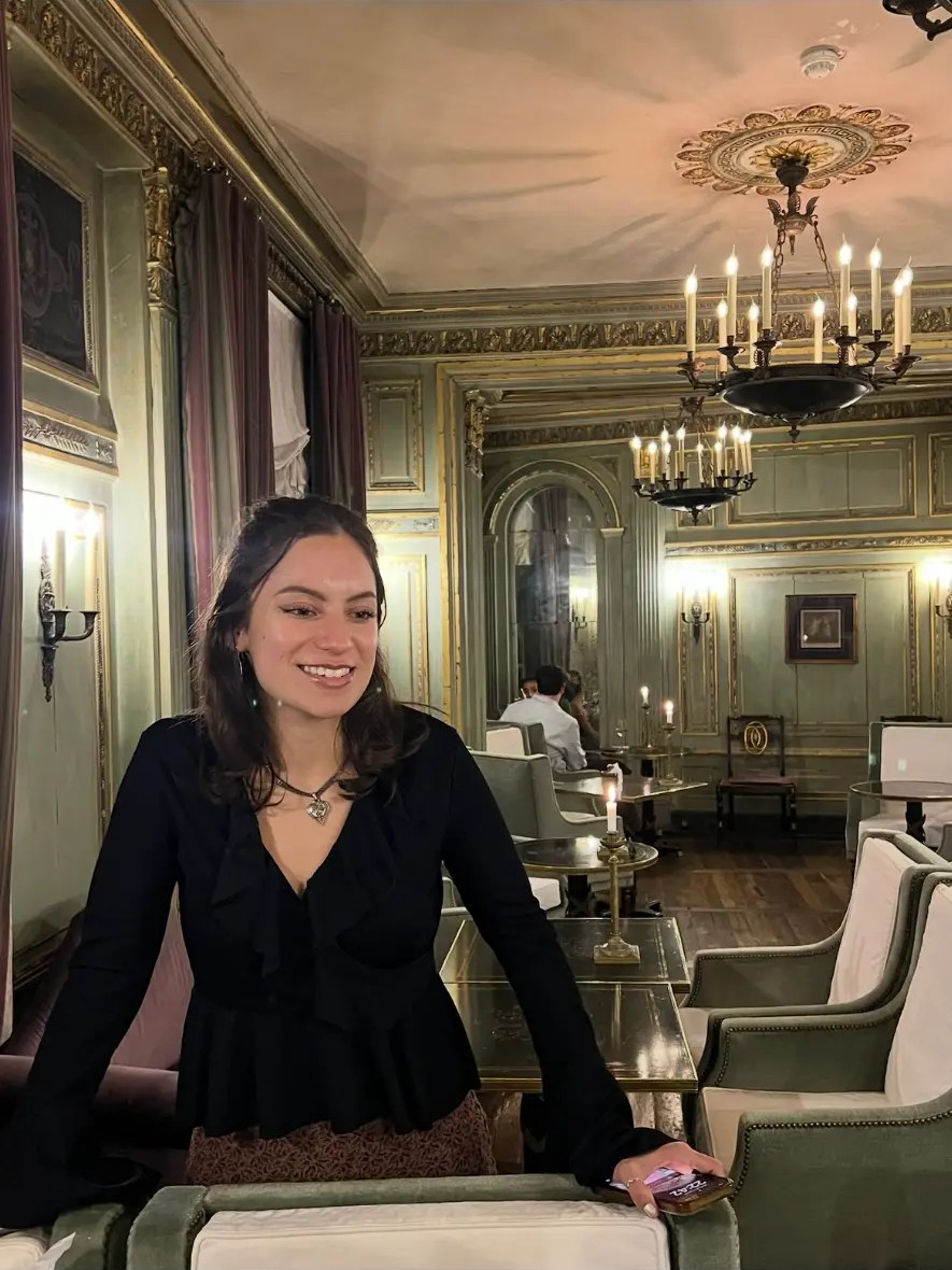 Lauren in a candlelit Parisian salon