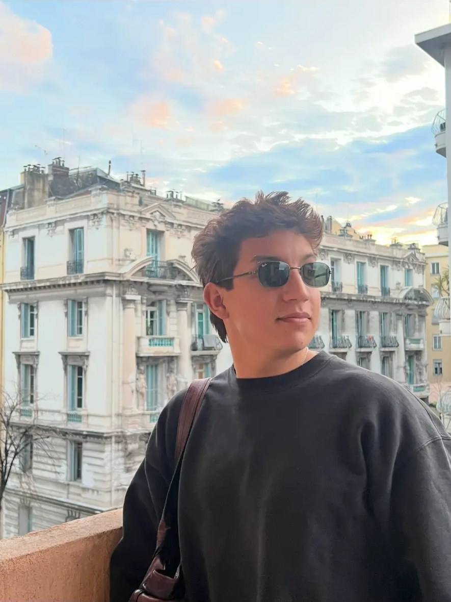 Mark on a balcony before classic European facades